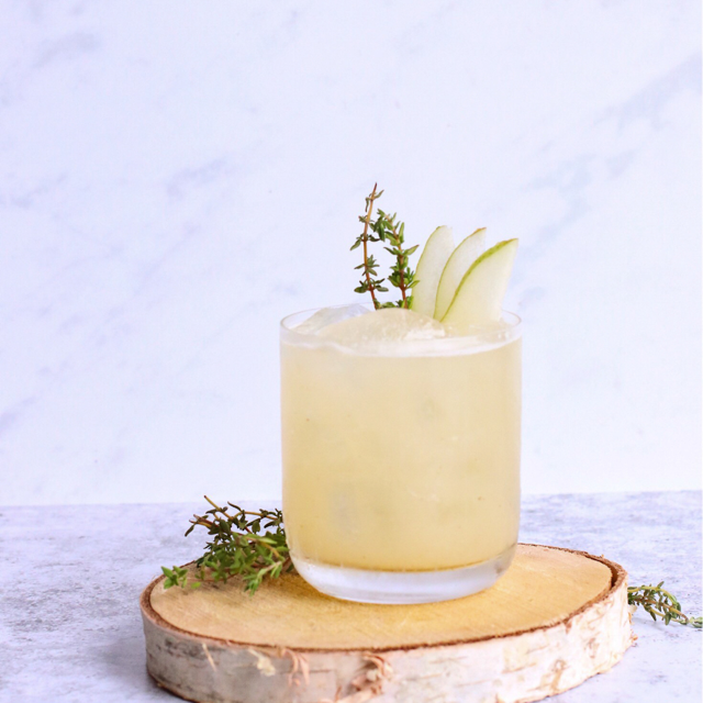 Mocktail with Tweedle, muddled apples, lemon and powdered sugar